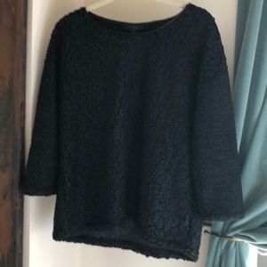 Textured top with faux leather trim